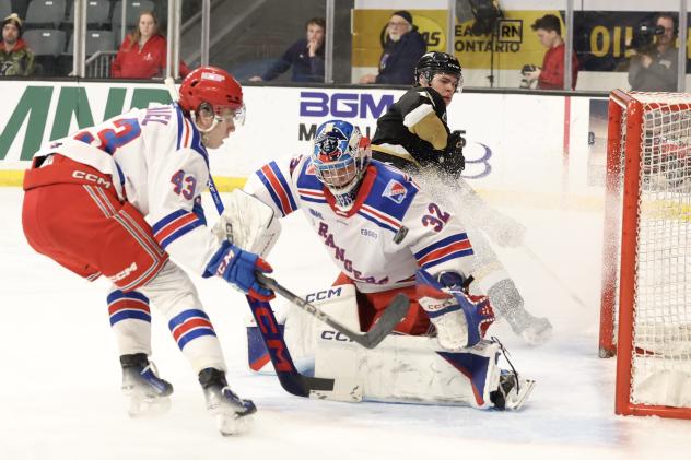 Kitchener Rangers' Andrew MacNiel and Jackson Parsons in action