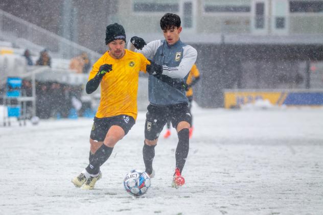 Robbie Mertz of the Pittsburgh Riverhounds (left) vs. Columbus Crew 2