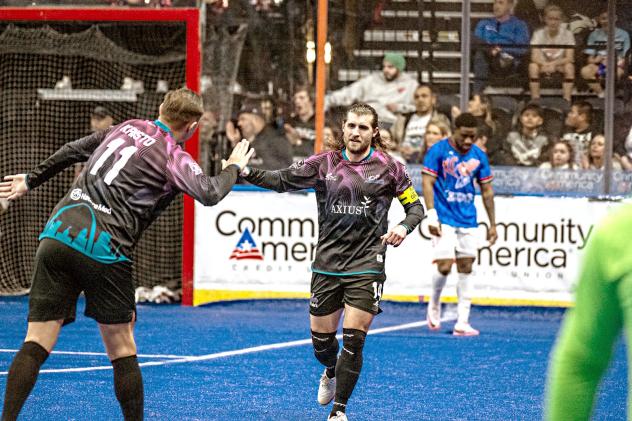St. Louis Ambush forward Robert Kristo (left) congratulates William Eskay