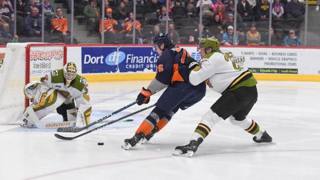 Flint Firebirds' Nathan Aspinall battles the North Bay Battalion