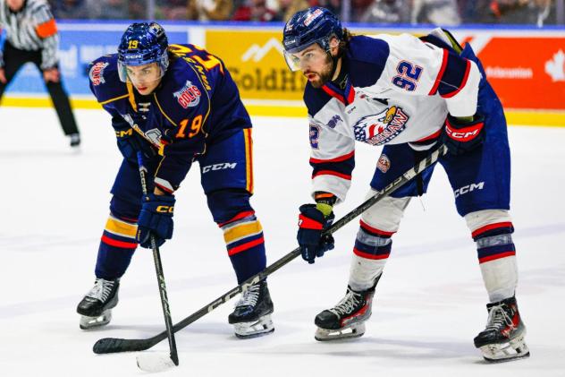 Saginaw Spirit right wing Nic Sima (right) faces off with the Barrie Colts