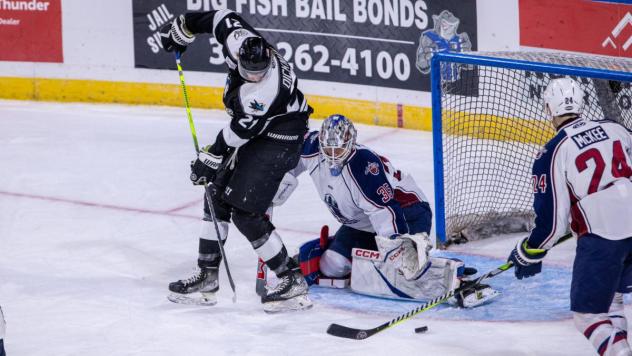 Wichita Thunder's Jay Dickman battles Tulsa Oilers' Talyn Boyko