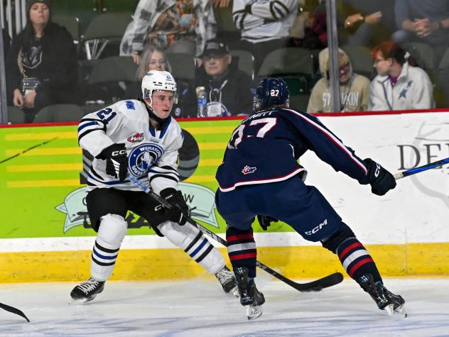 Wenatchee Wild's Reid Andresen battles Tri-City Americans' Brandon Whynott