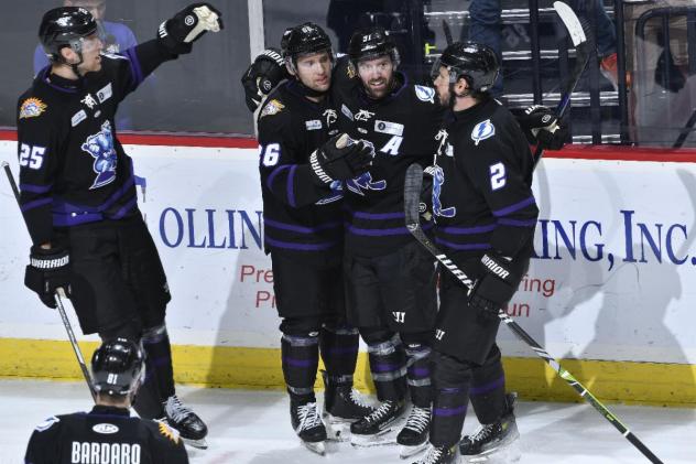 Orlando Solar Bears huddle following a goal
