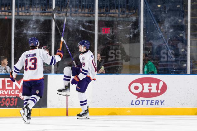 Youngstown Phantoms defenseman Luke Osburn (left) rushes to congratulate Jack Willson