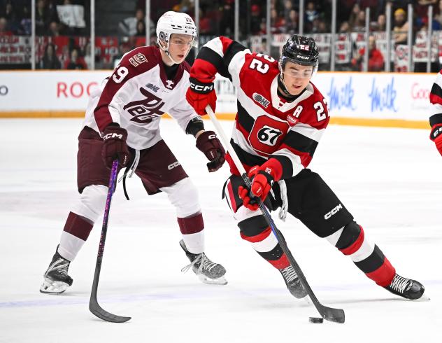 Peterborough Petes left wing Caden Taylor (left) vs. the Ottawa 67's