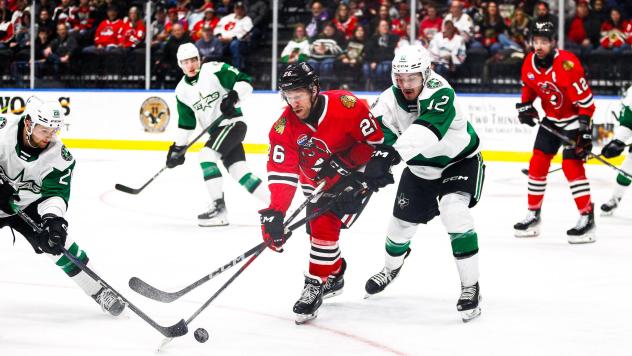 Rockford IceHogs' Gerry Mayhew versus Texas Stars' Arttu Hyry