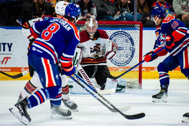 Tucson Roadrunners' Matthew Villalta battles Bakersfield Condors' Connor Corcoran and Derek Ryan