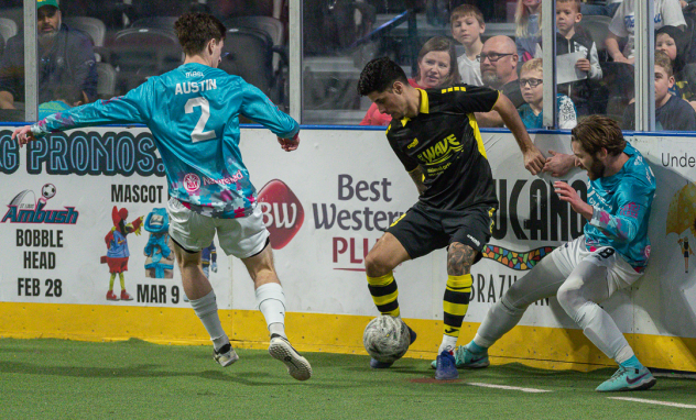St. Louis Ambush forward Triston Austin (left) and defender Dylan Hundelt battle the Milwaukee Wave