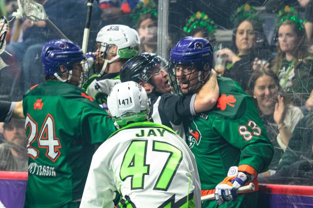 Saskatchewan Rush' Adam Jay and Halifax Thunderbirds' Clarke Petterson and Randy Staats on game night