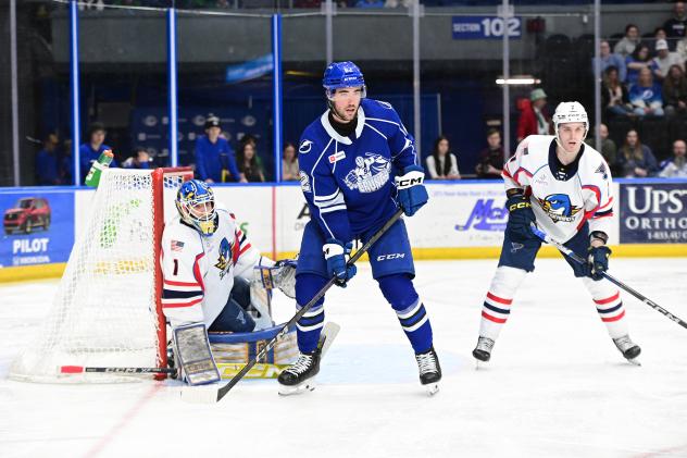Syracuse Crunch's Jack Finley and Springfield Thunderbirds' Vadim Zherenko and Leo Lööf on game night
