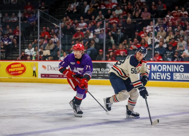 Grand Rapids Griffins' Cross Hanas and Milwaukee Admirals' Jesse Ylönen on the ice