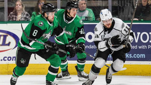 Texas Stars' Gavin White and Antonio Stranges and Ontario Reign's Samuel Fagemo in action