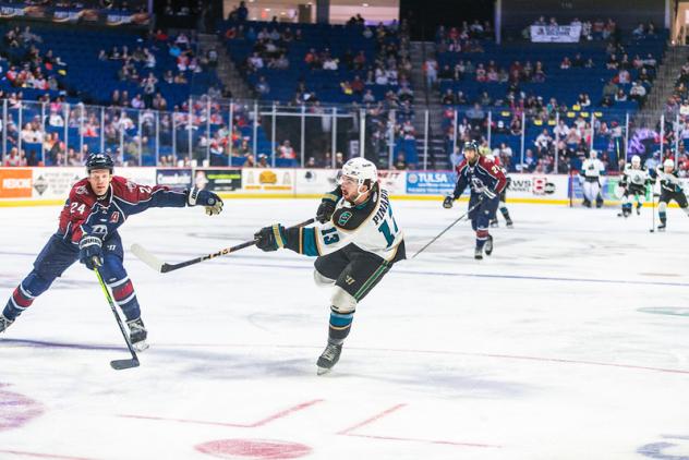 Tulsa Oilers' Mike McKee and Tahoe Knight Monsters' Simon Pinard in action