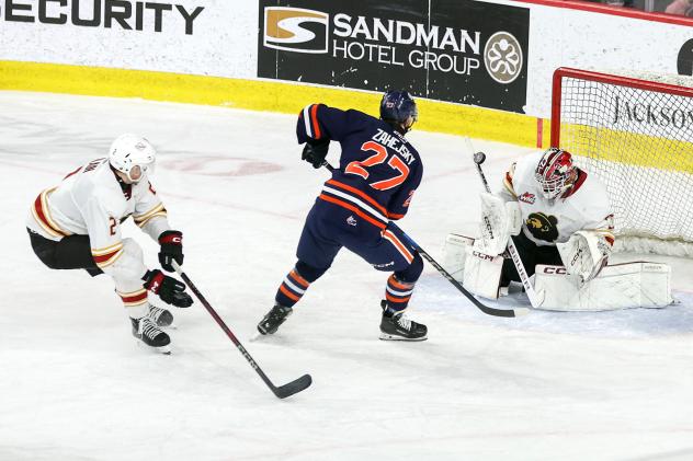 Kamloops Blazers' Vít Záhejský battles Vancouver Giants' Colton Alain and Burke Hood