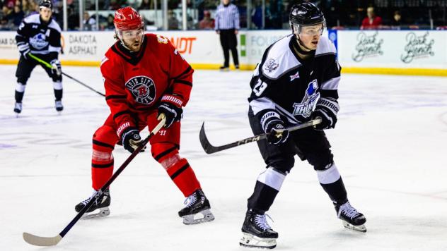 Wichita Thunder forward Luke Grainger (right) vs. the Rapid City Rush