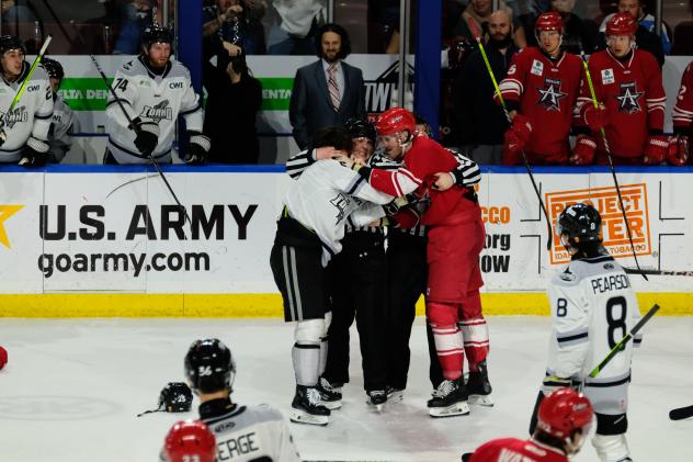 Allen Americans and Idaho Steelheads hug the officials