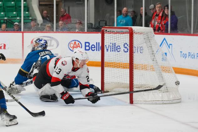 Cleveland Monsters' Jet Greaves and Belleville Senators' Cole Reinhardt in action