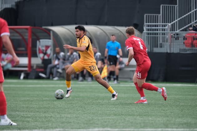 Rhode Island FC midfielder Marc Ybarra with possession vs. Loudoun United FC