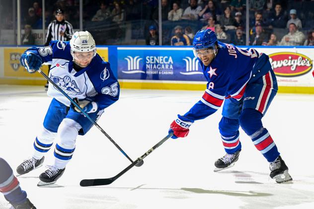 Syracuse Crunch forward Dylan Duke (left) vs. the Rochester Americans