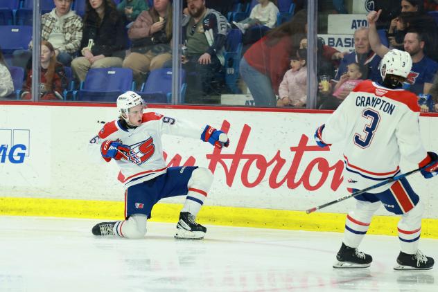 Spokane Chiefs react following a score
