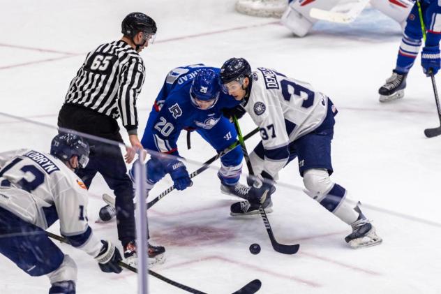 Worcester Railers forward Matt DeMelis (right) faces off with the Trois-Rivières Lions