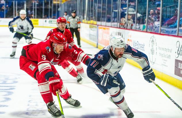 Allen Americans defenseman Hudson Wilson (left) vs. the Tulsa Oilers