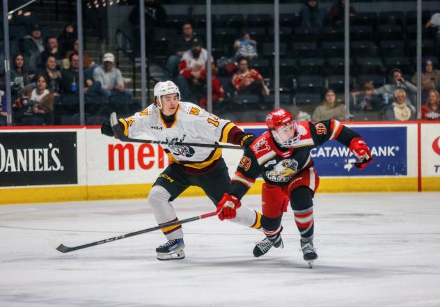 Grand Rapids Griffins center Amadeus Lombardi (right) vs. the Chicago Wolves