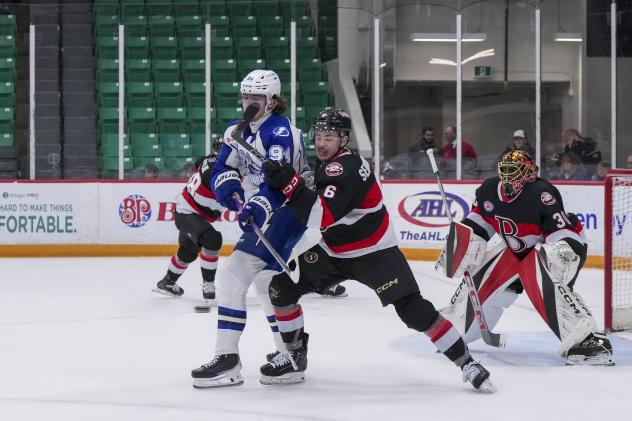 Belleville Senators defenceman Donovan Sebrango (right) vs. the Syracuse Crunch
