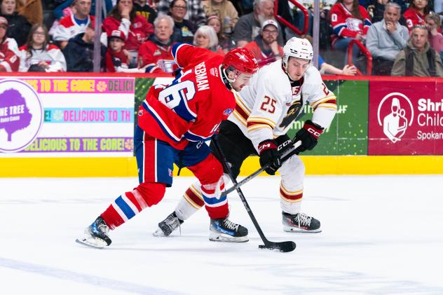 Vancouver Giants defenceman Kolby Gapter (right) vs. the Spokane Chiefs