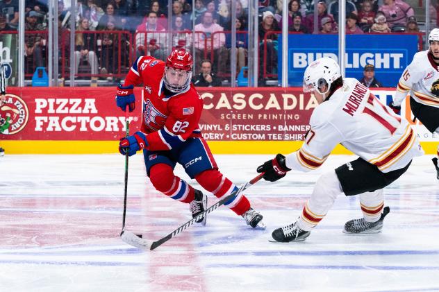 Vancouver Giants left wing Maxim Muranov (right) vs. the Spokane Chiefs