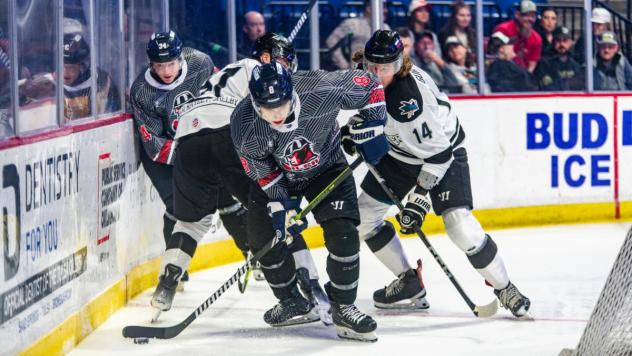 Tulsa Oilers' Reid Petryk and Wichita Thunder's Artyom Guryev in action