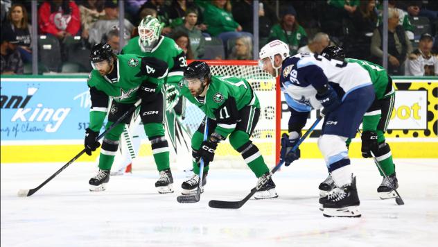 Texas Stars' Magnus Hellberg, Luke Krys, and Harrison Scott and Milwaukee Admirals' Kyle Marino