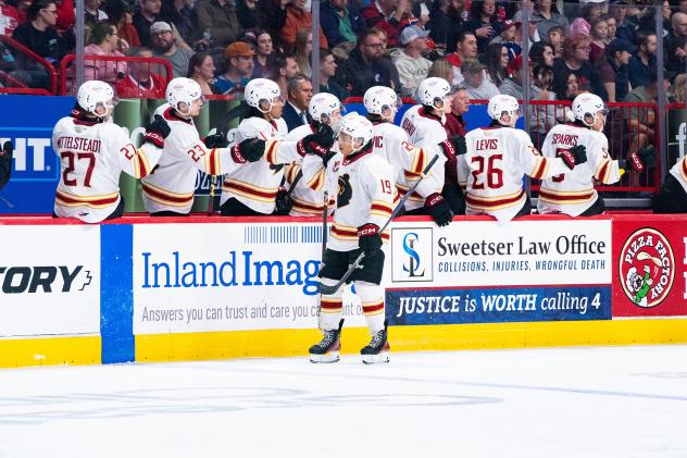 Vancouver Giants' Cameron Schmidt congratulated by team