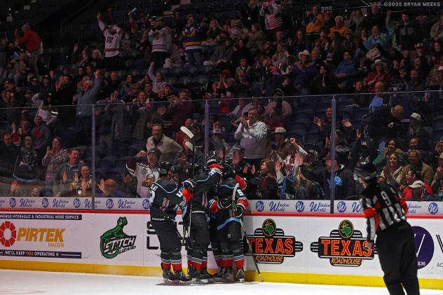 Macon Mayhem celebrate a goal in front of a big crowd
