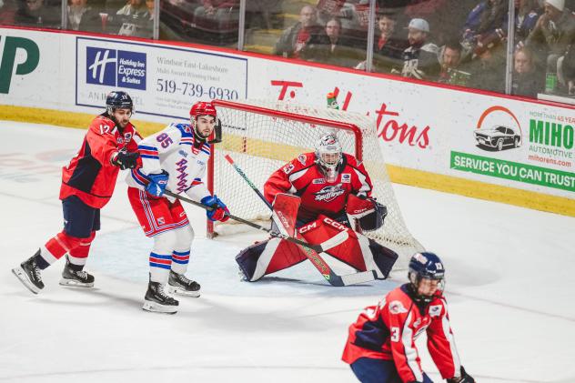 Kitchener Rangers left wing Chris Grisolia in front of the Windsor Spitfires net