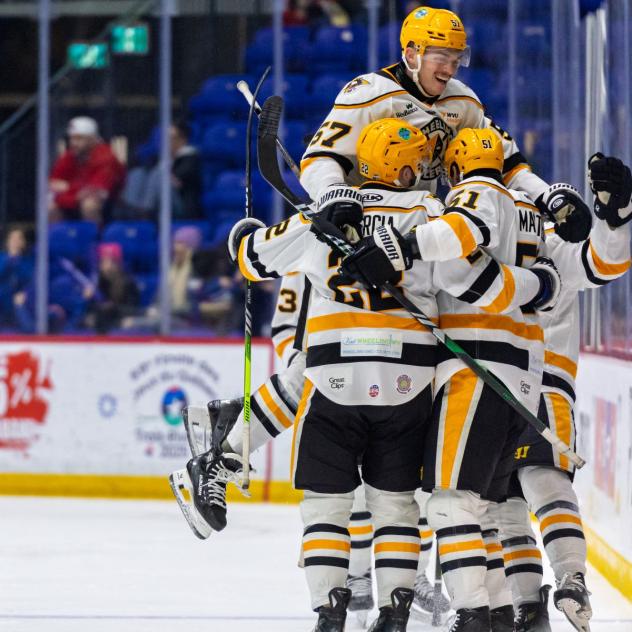 Wheeling Nailers' Phip Waugh, Matt Quercia, and Jordan Martel celebrate win