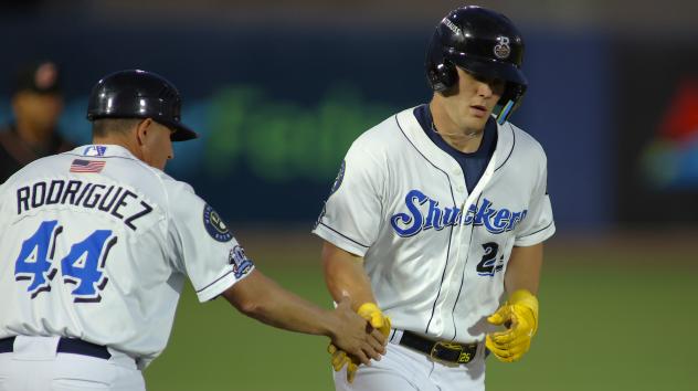 Biloxi Shuckers' Carlos Rodriguez congratuleates Brock Wilken
