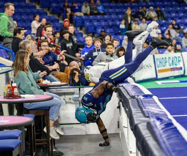 Marquis Waters of the Massachusetts Pirates goes over the wall
