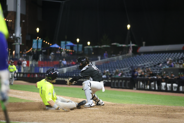 Colton Becker of the Columbia Fireflies slides home