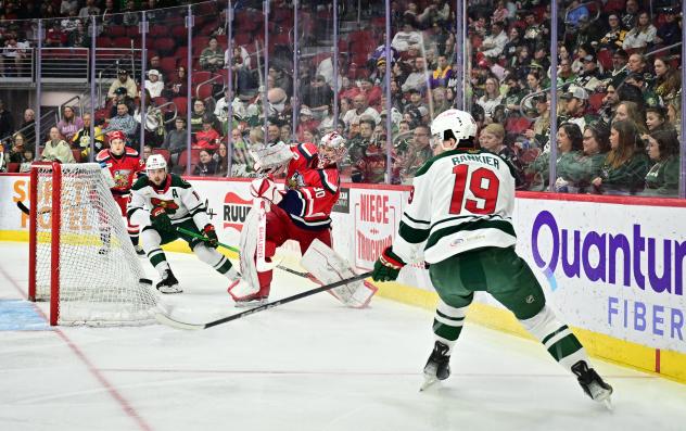 Grand Rapids Griffins' Jack Campbell and Iowa Wild's Caedan Bankier in action