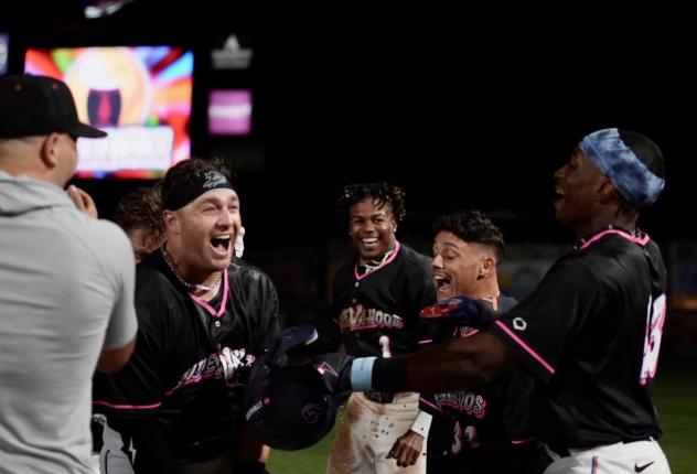 Josh Zamora and the Pensacola Blue Wahoos celebrate a walk-off win