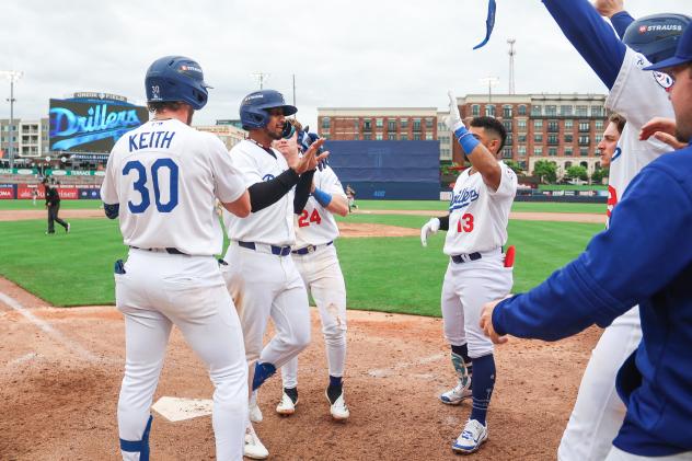 Jose Ramos celebrates with Tulsa Drillers teammates