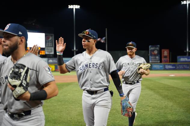 Dylan Jasso of the Somerset Patriots exchanges high fives