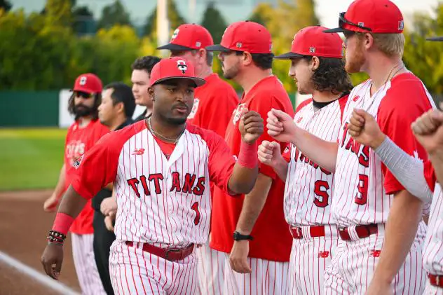 Ottawa Titans exchange fist bumps before a game