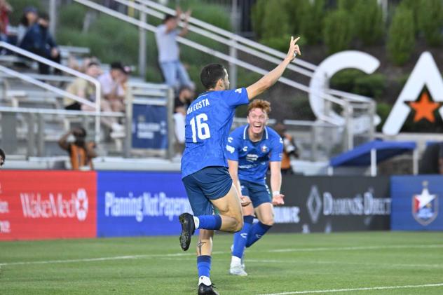 Rodrigo Da Costa of North Carolina FC celebrates with Adam Luckhurst