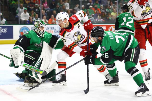 Texas Stars' Rémi Poirier and Michael Karow battle Grand Rapids Griffins' Dominik Shine