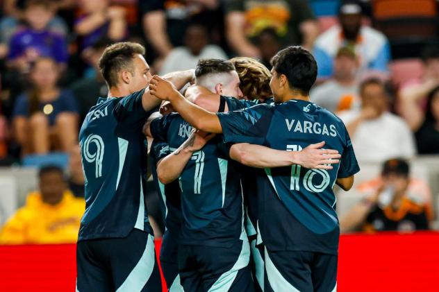 Seattle Sounders FC's Danny Musovski, Ryan Kent, and Obed Vargas celebrate win