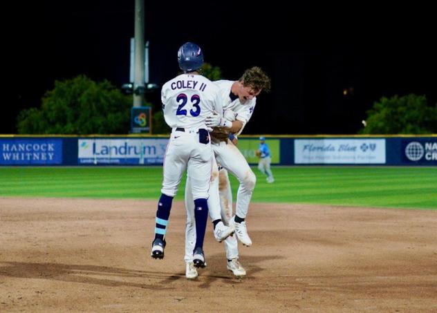 Pensacola Blue Wahoos celebrate Johnny Olmstead's game-winning single