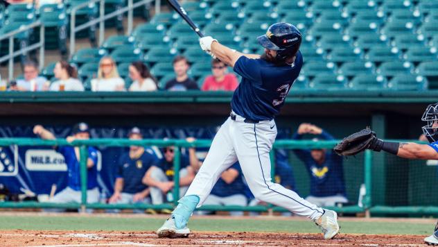 Matthew Etzel swings away for the Montgomery Biscuits